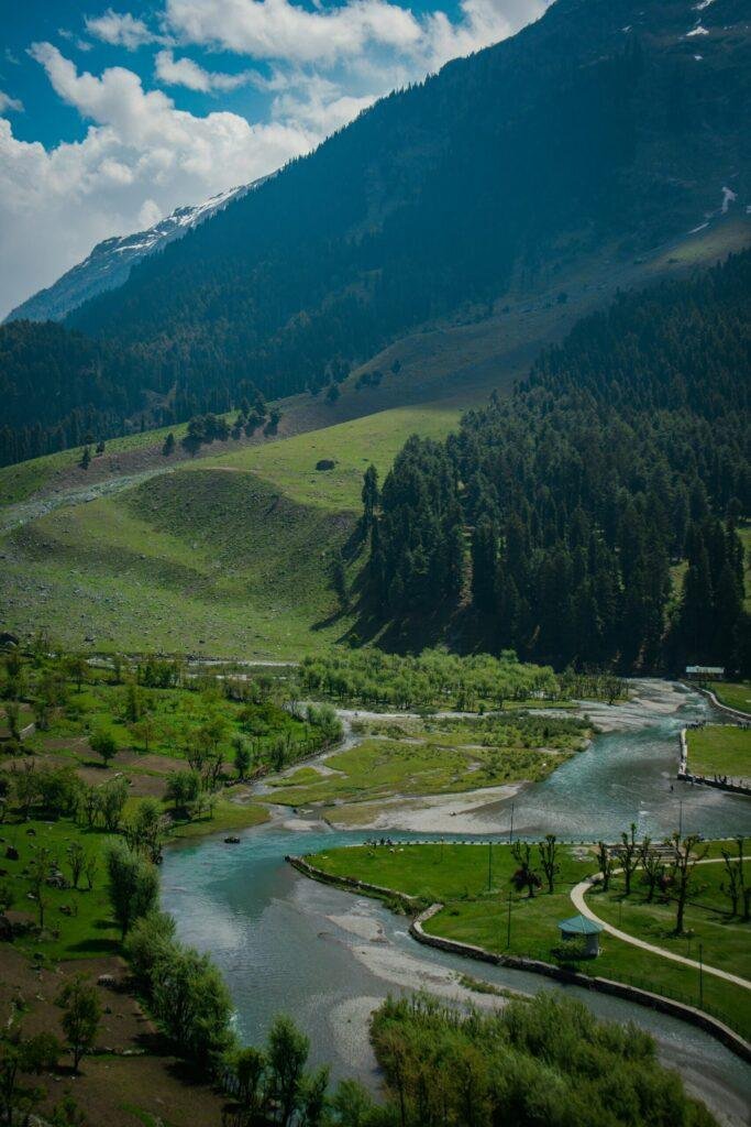 Romantic Betaab Valley scenery with lush green meadows and Lidder River at Pahalgam, Kashmir, India