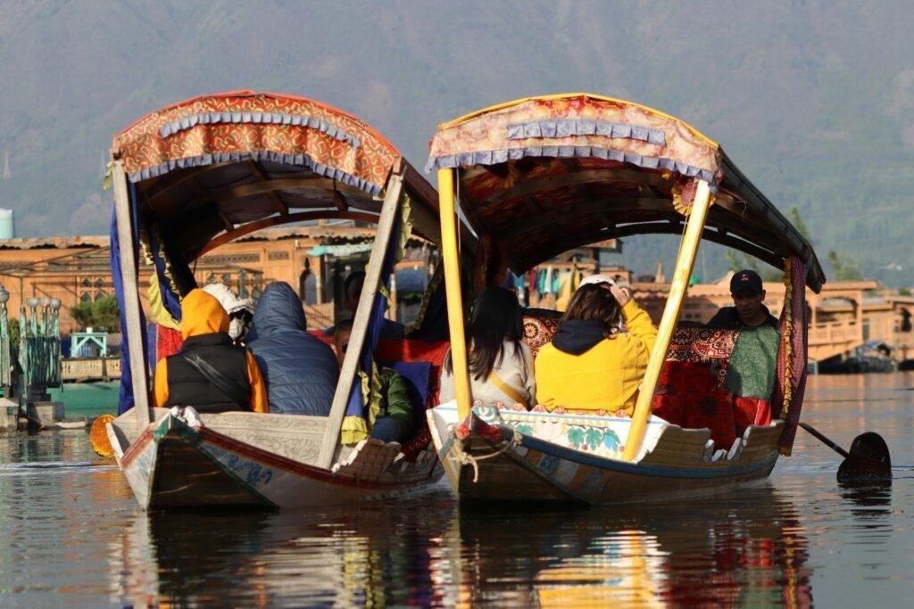 Sunset Shikara ride on Dal Lake with golden sky reflections, Srinagar, Kashmir honeymoon experience