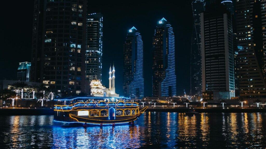 Dubai Marina night cruise with illuminated skyline and waterfront views United Arab Emirates