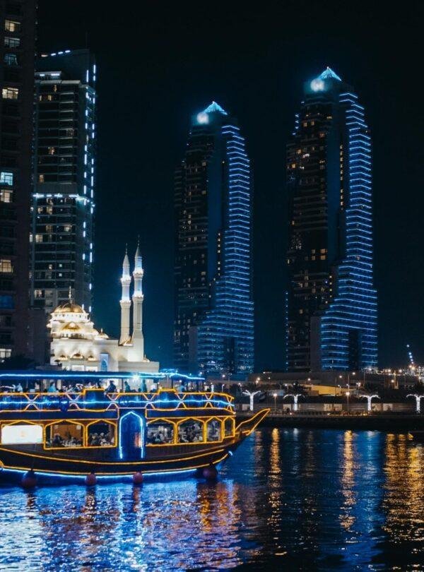 Dubai Marina night cruise with illuminated skyline and waterfront views United Arab Emirates