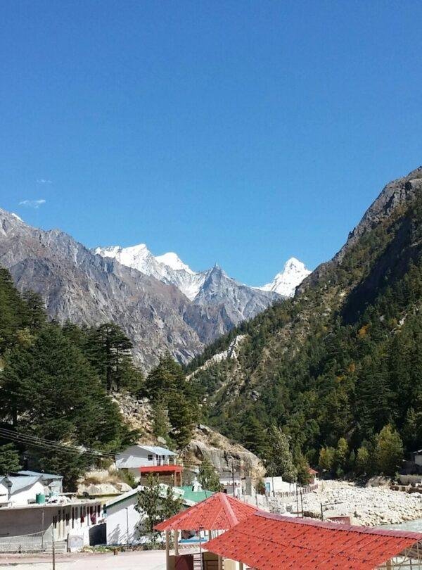 Gangotri Dham and Bhagirathi River with pilgrims at the sacred Char Dham pilgrimage site in Uttarakhand, India