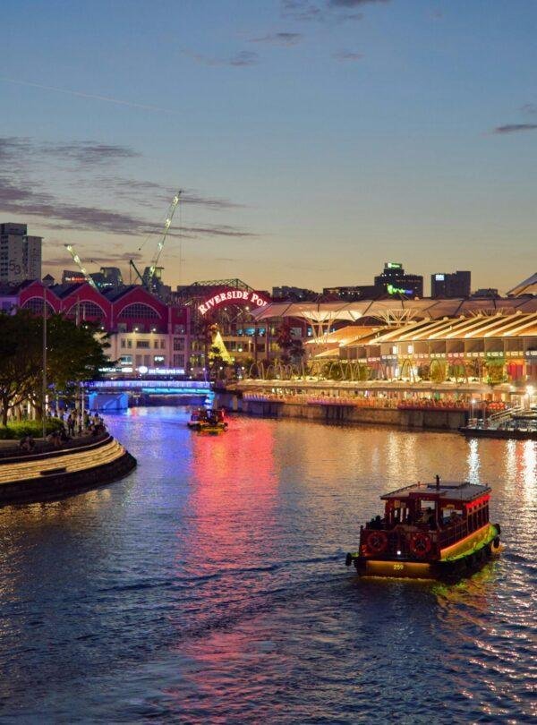 Genting Dream luxury cruise ship docked at Singapore port on a cruise tour