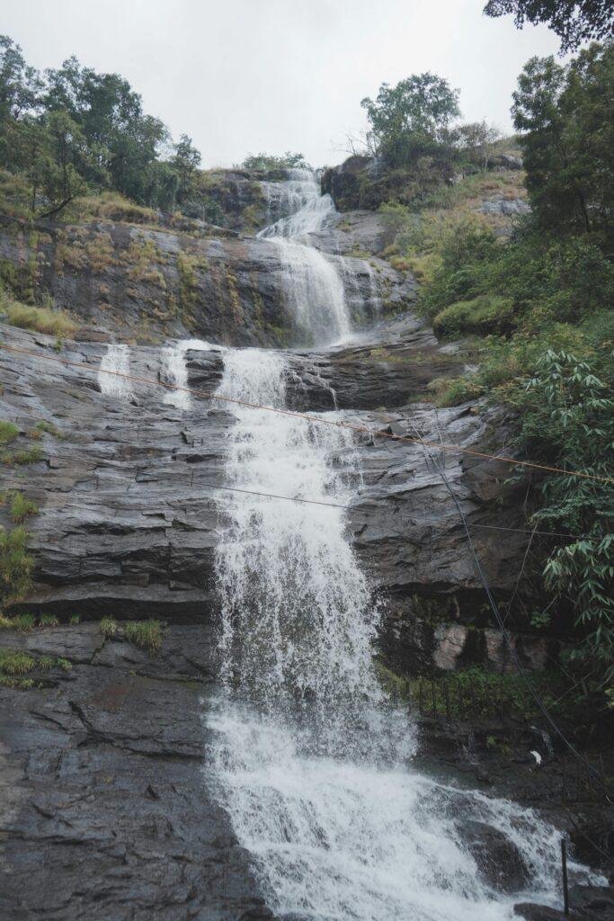 Lakkom Waterfalls trek near Munnar Kerala scenic waterfall between green hills