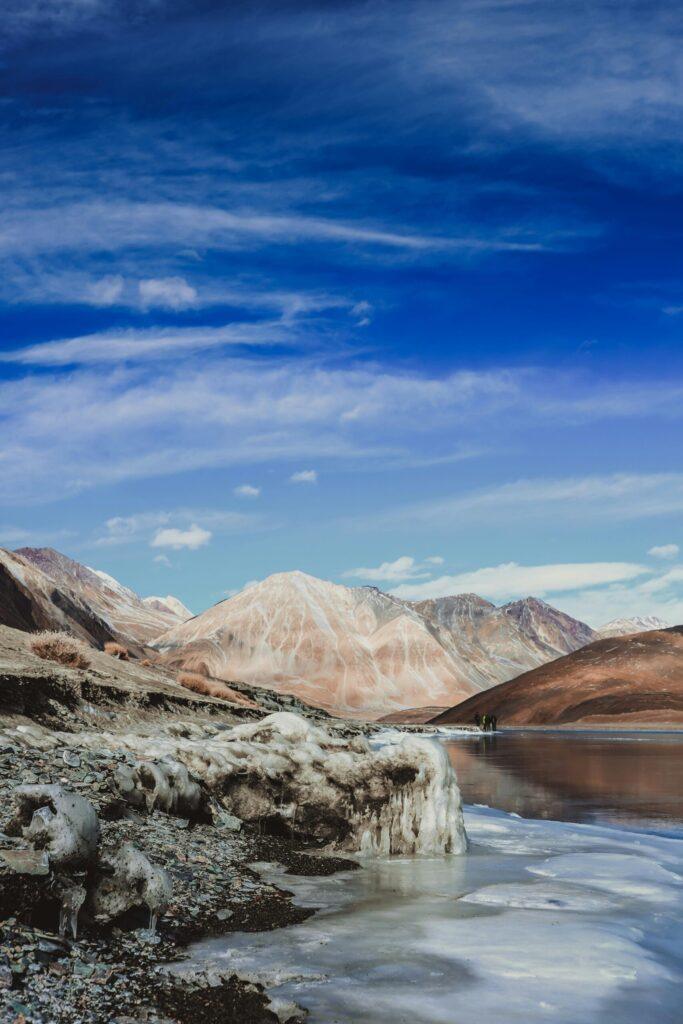 Leh‑Ladakh bike adventure on Himalayan roads with rugged mountain backdrop India