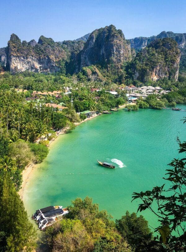 Railay Beach in Krabi Thailand with white sand and limestone cliffs on Andaman Sea