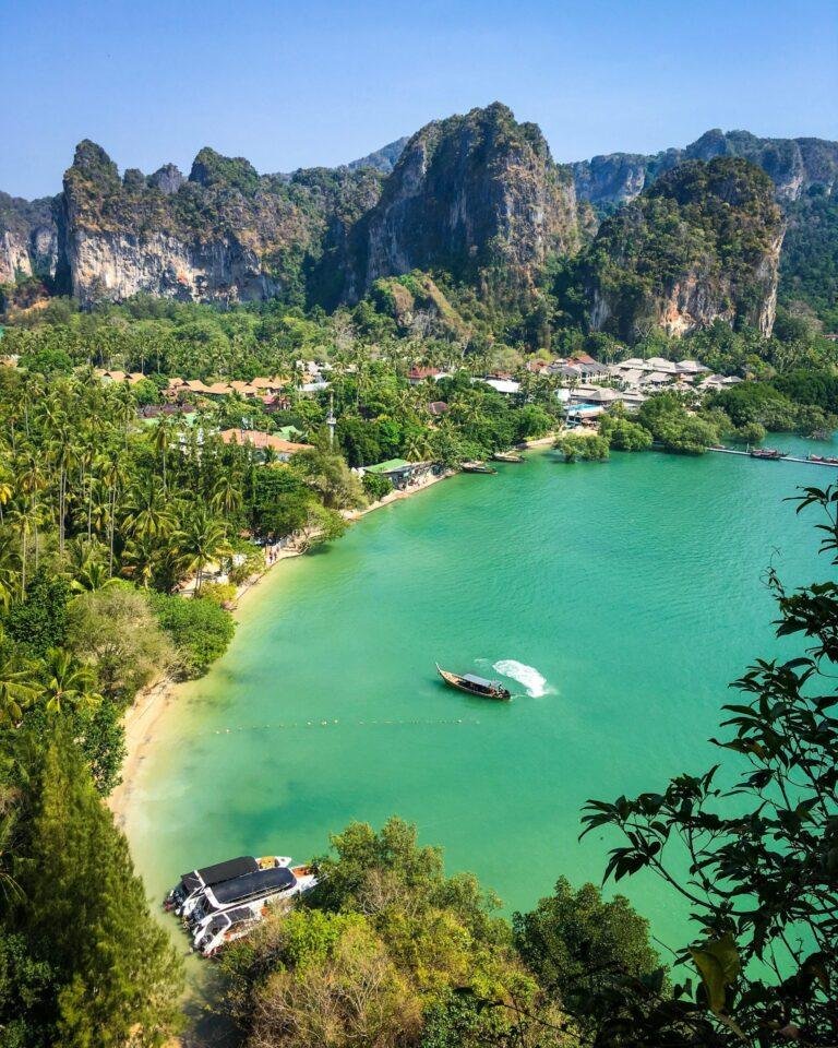 Railay Beach in Krabi Thailand with white sand and limestone cliffs on Andaman Sea