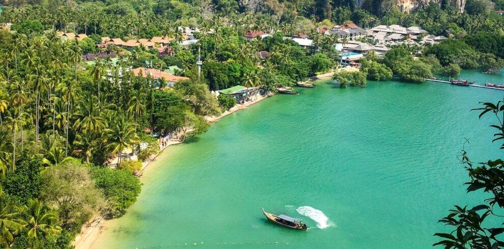 Railay Beach in Krabi Thailand with white sand and limestone cliffs on Andaman Sea