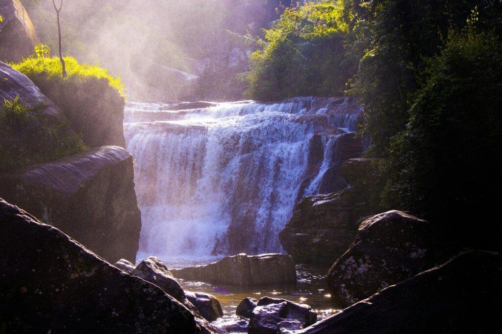 Scenic view of Ramboda Waterfall surrounded by lush greenery in Nuwara Eliya