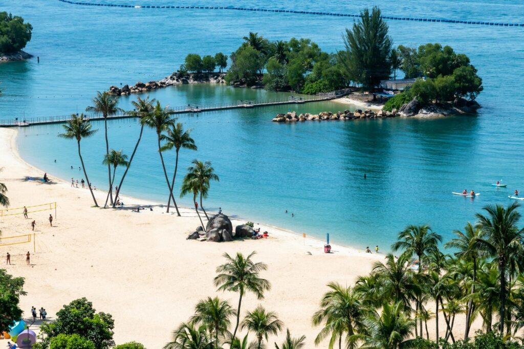 Sentosa Island beach shoreline with blue waters and sandy coast in Singapore