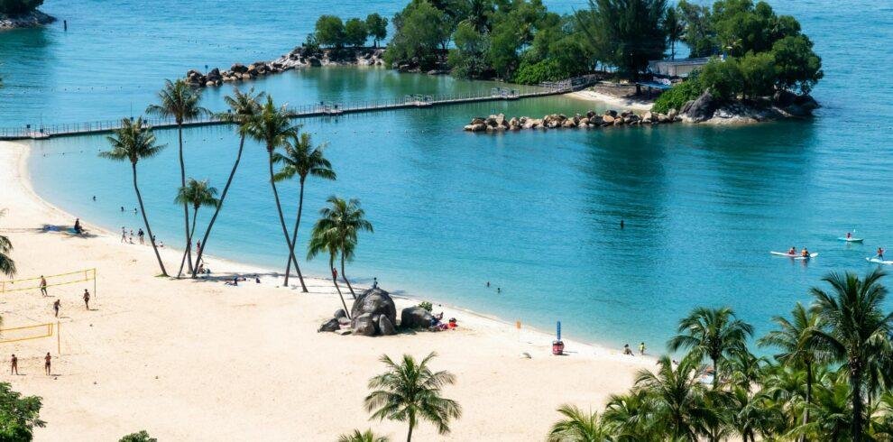 Sentosa Island beach shoreline with blue waters and sandy coast in Singapore