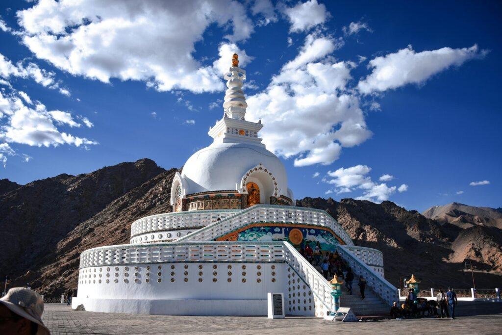 Shanti Stupa white‑domed Buddhist monument overlooking Leh city and Himalayan mountains India