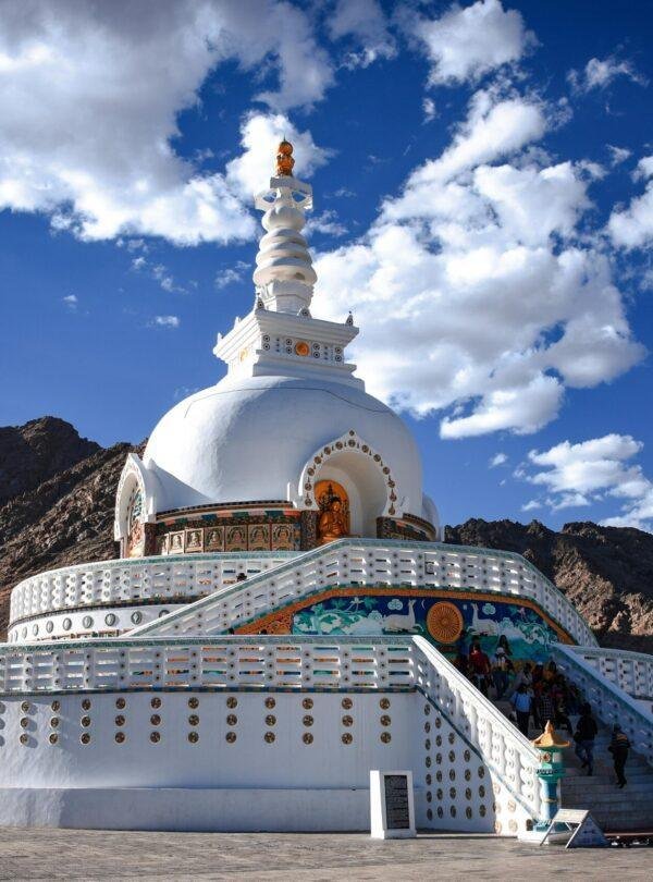 Shanti Stupa white‑domed Buddhist monument overlooking Leh city and Himalayan mountains India