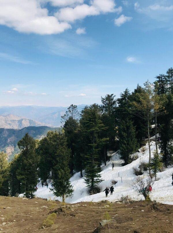 People enjoying snow activities at Kufri snow point near Shimla, Himachal Pradesh