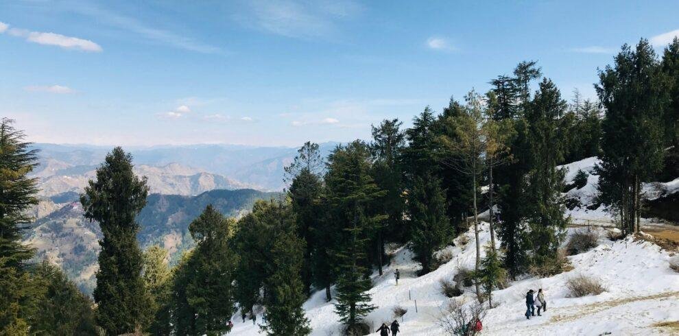 People enjoying snow activities at Kufri snow point near Shimla, Himachal Pradesh