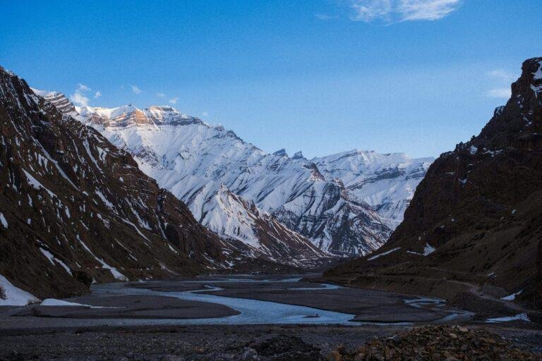 Spiti Valley winter tour with snow‑covered Himalayan mountains and icy valley landscape India