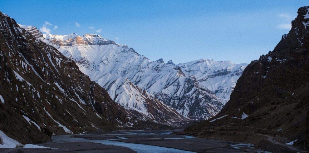 Spiti Valley winter tour with snow‑covered Himalayan mountains and icy valley landscape India