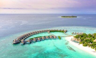 Sun Siyam Maldives luxury resort beachfront and overwater villas with turquoise lagoon